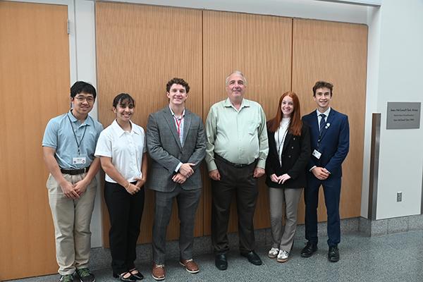 Photo of students and speakers from 2025 conference